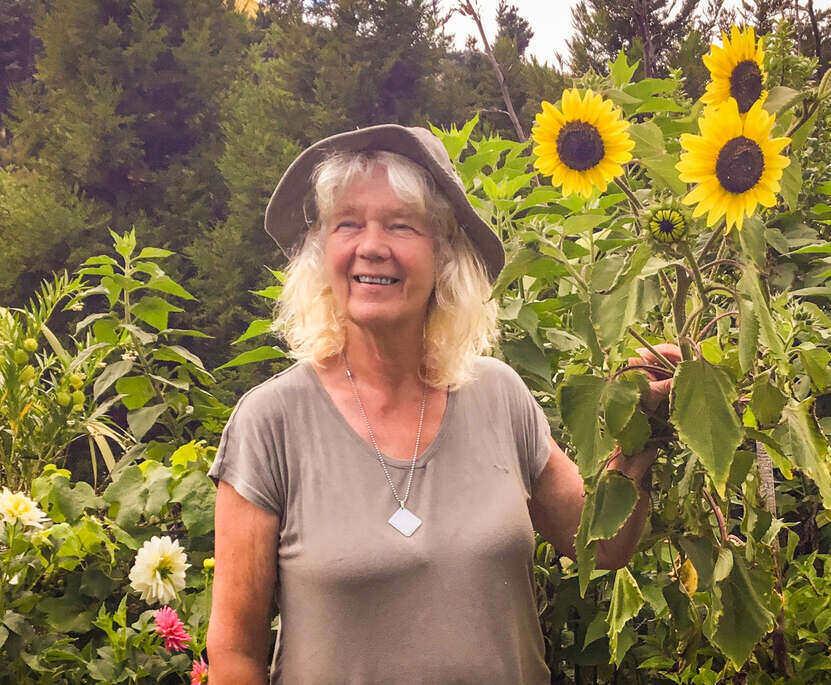 Hella, one of our trustees, in her permaculture garden at home
